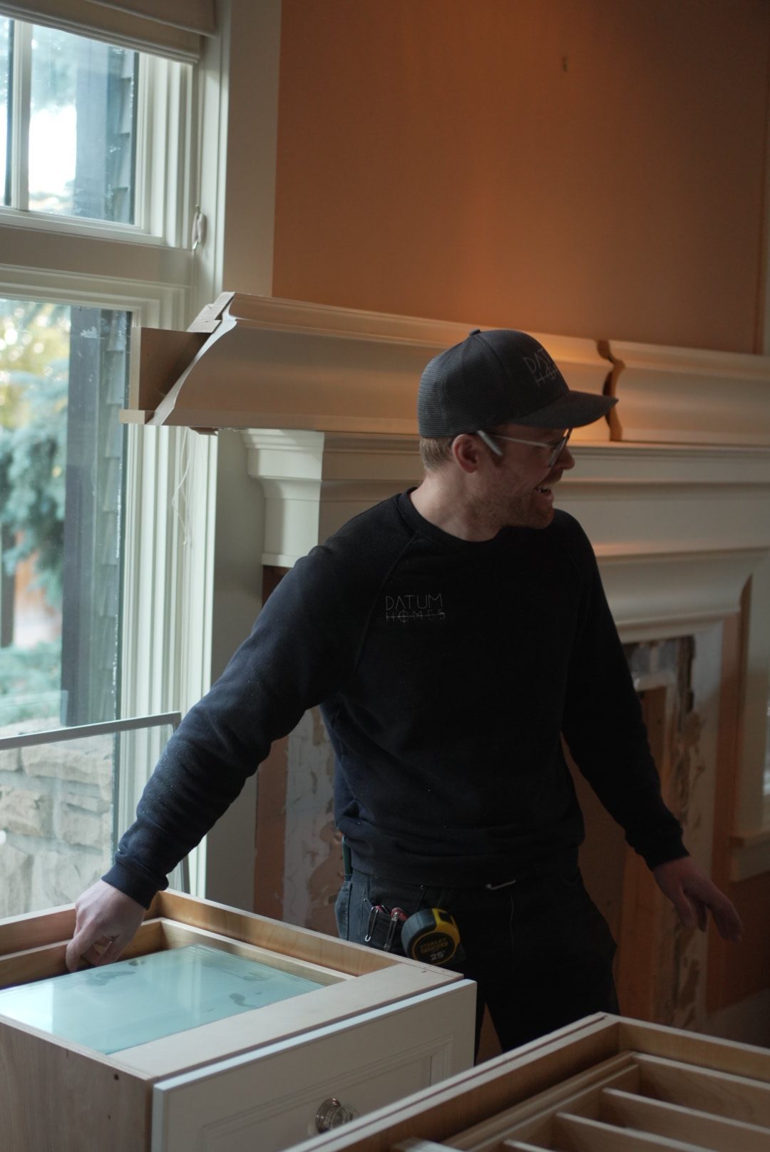 A Datum tradesperson inspecting cabinetry on site